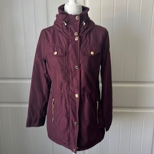 Ladies Michael Kors rain jacket, burgundy, small.